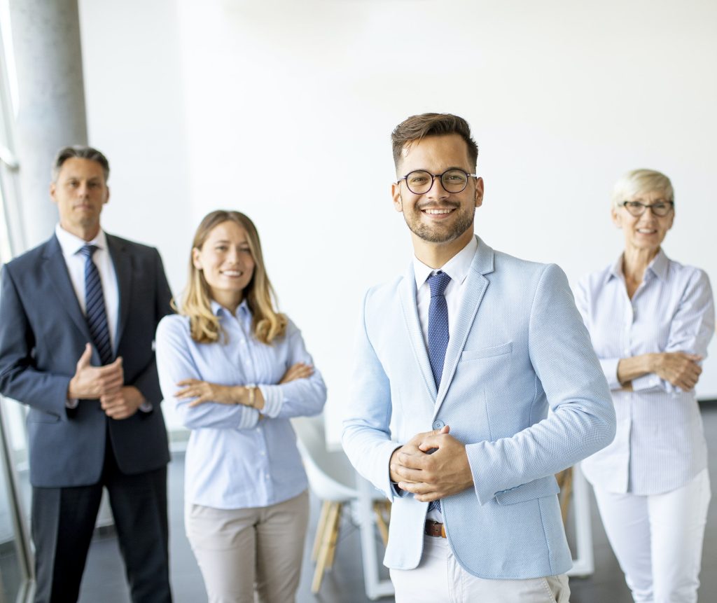 Group of a businesspeople standing together in the office
